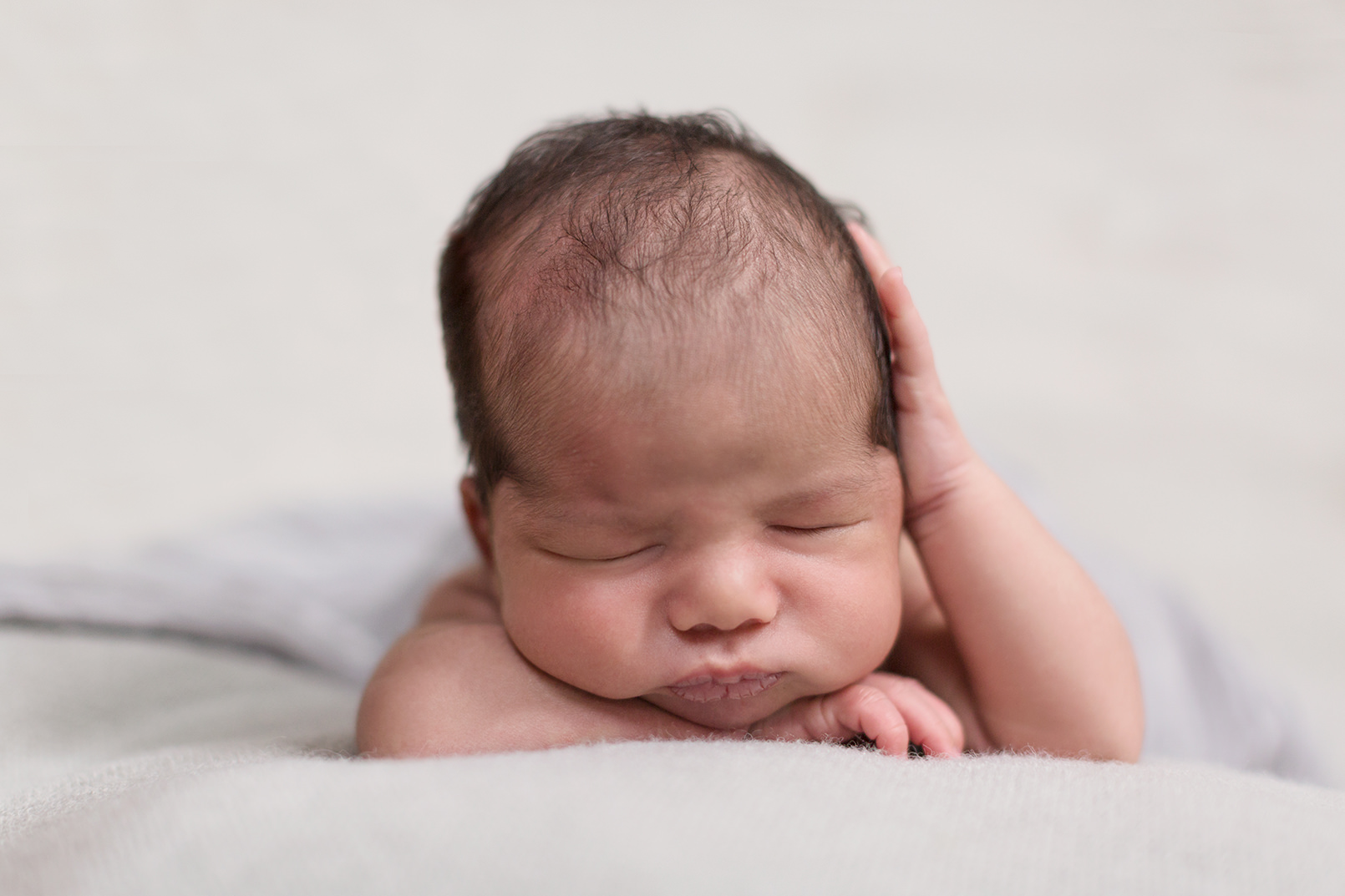 newborn sleeping with head in hands Melbourne Newborn Photography