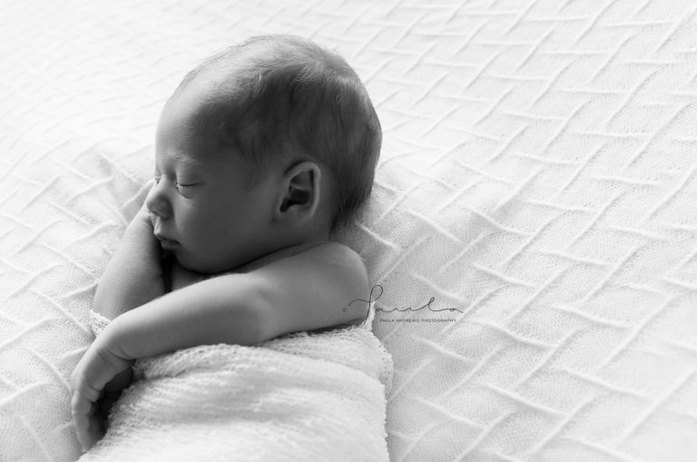 Baby sleeping on his side