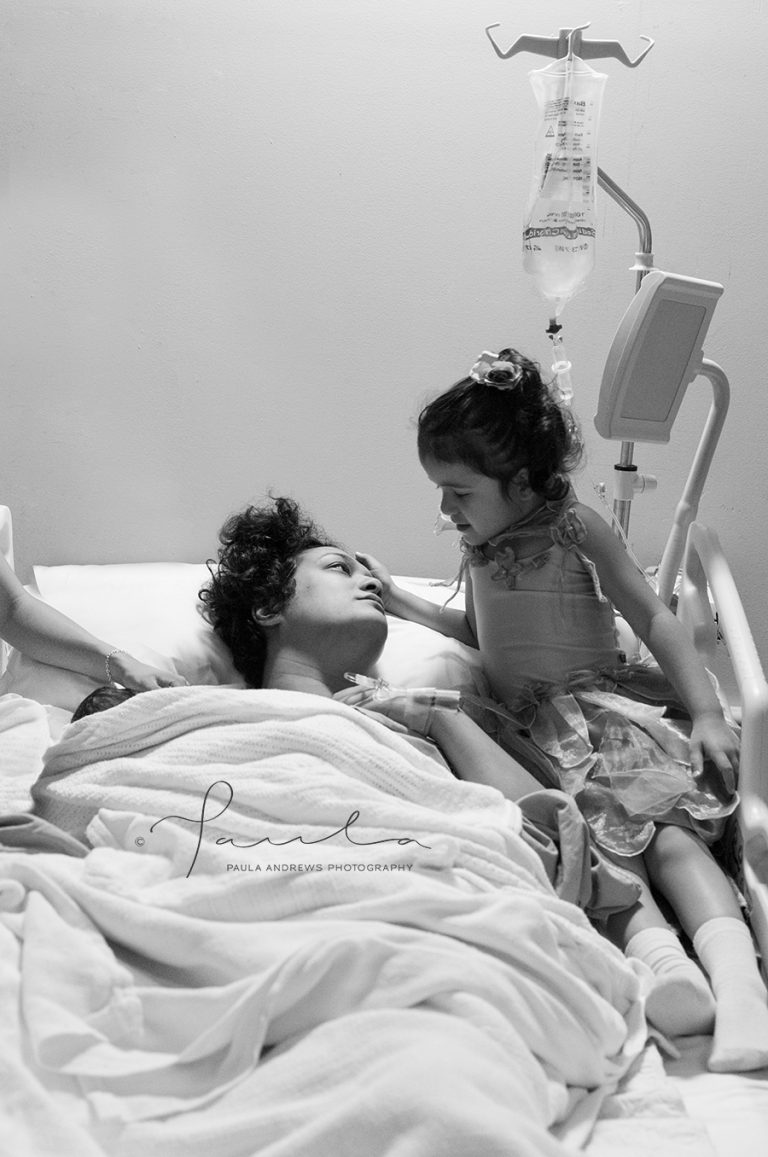Mother with her 2 children moments after giving birth
