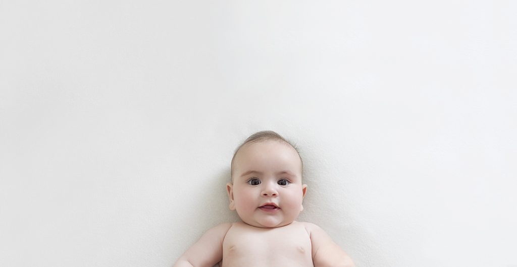 Smiling 4 month old baby girl