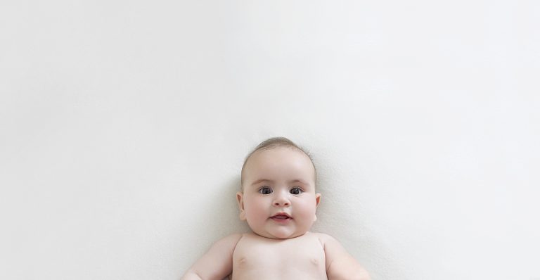 Smiling 4 month old baby girl