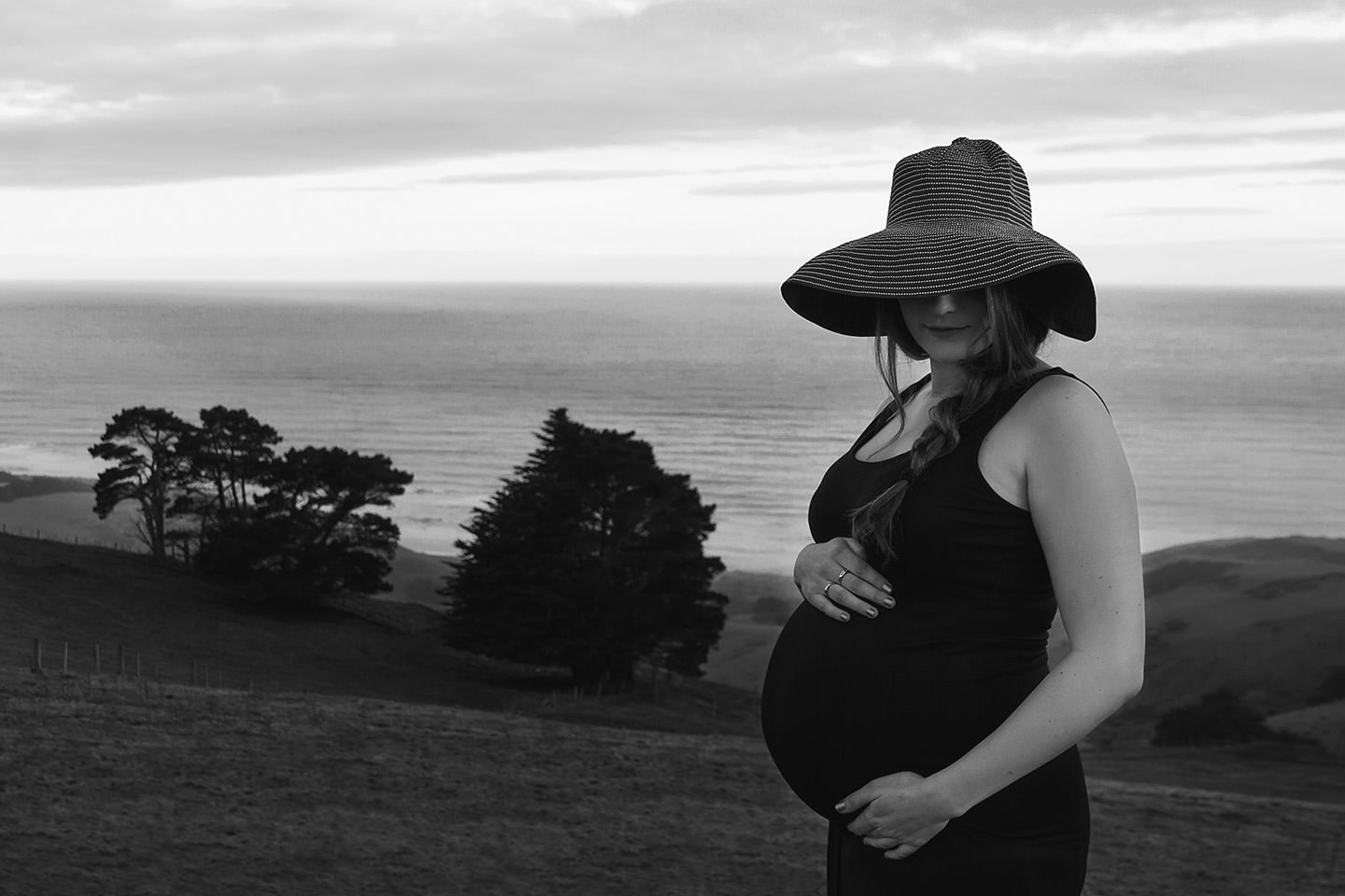 Pregnant lady in sunhat on Otago Peninsula
