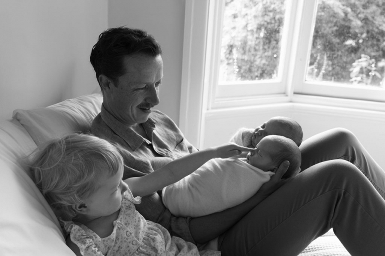 Twin in-home newborn photoshoot with big sister and proud Dad of three in Northcote