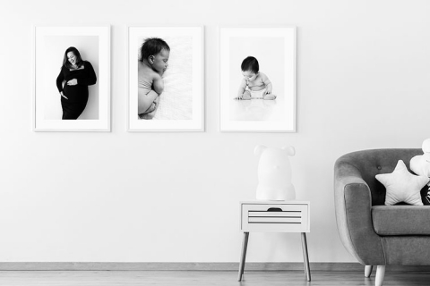 Framed maternity and newborn prints in family home