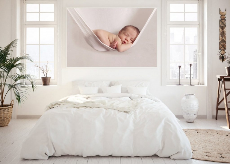 large newborn print on bedroom wall