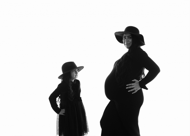 Mother and daughter at maternity photoshoot